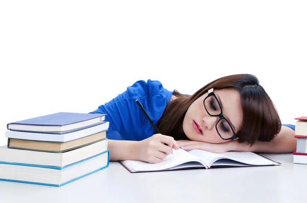 Tired young woman writing — Stock Photo, Image