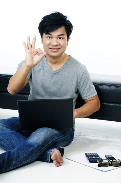 Casual young man giving OK gesture — Stock Photo, Image
