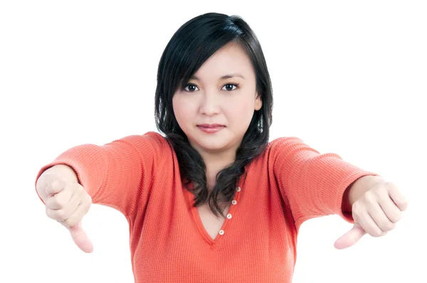 Unhappy woman showing thumbs down sign — Stock Photo, Image