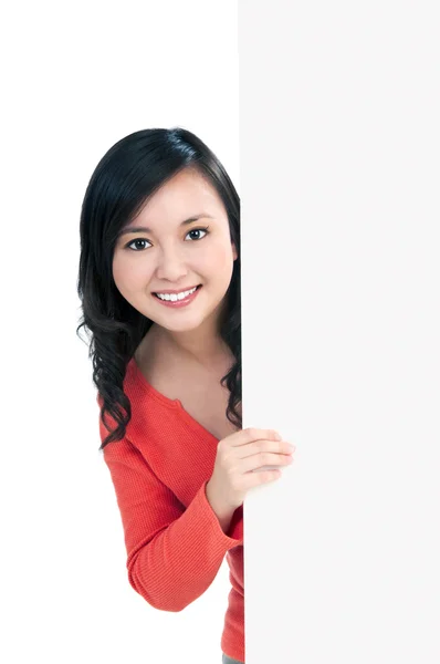 Beautiful young woman holding billboard — Stock Photo, Image