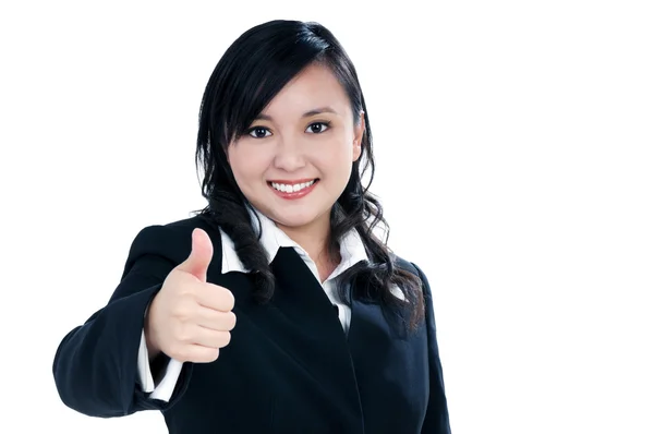 Attractive businesswoman giving thumb up gesture — Stock Photo, Image