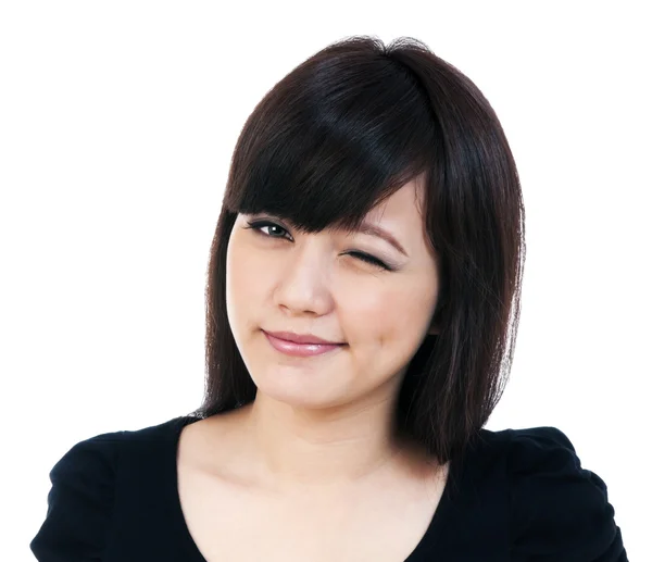 Roztomilá mladá asijská žena mrkání — Stock fotografie