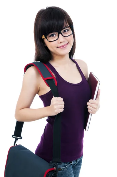 Счастливая студентка носит с собой книгу и сумку — стоковое фото