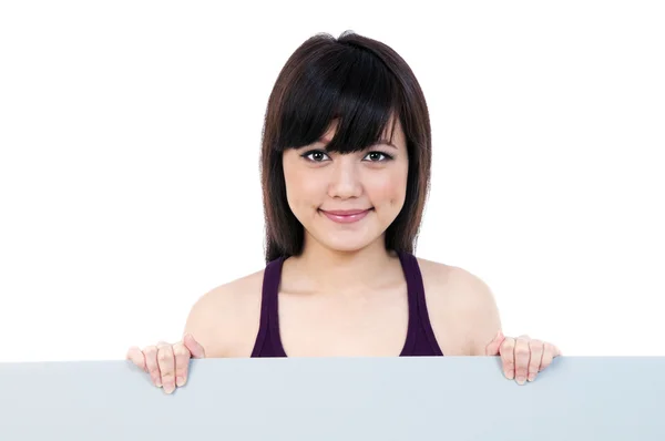 Güzel bir genç kadın holding billboard — Stok fotoğraf
