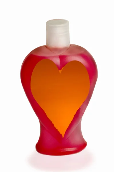 Frasco de perfume com coração vermelho — Fotografia de Stock