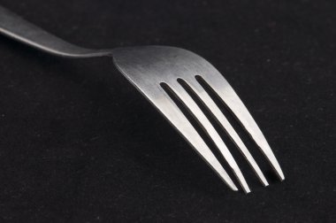 Fork in black background clipart
