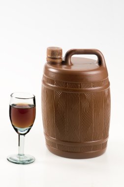 Barrel with a glass of red wine on white background clipart