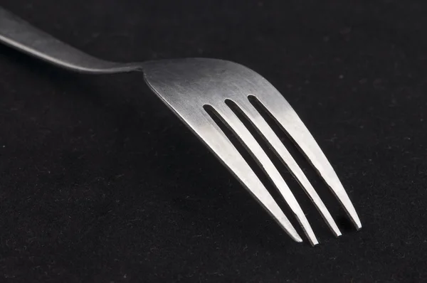 Fork in black background — Stock Photo, Image