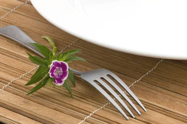 Rice spoon and fork and white flower — Stock Photo, Image