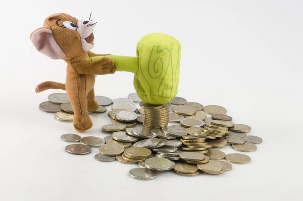 Coins and luck doll — Stock Photo, Image
