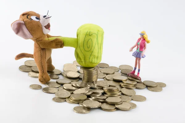 Coins and luck doll — Stock Photo, Image