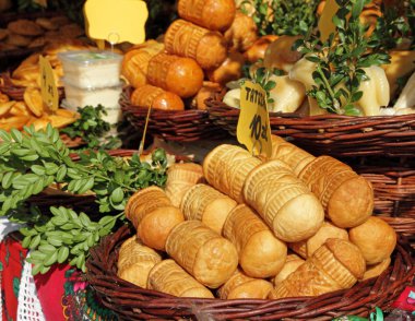 Traditional polish oscypek cheese on market in Krakow clipart