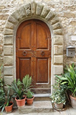 Wooden retro door with stone arch clipart