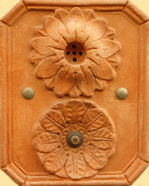 Retro artistic doorbell made in terracotta Stock Image