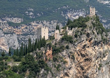 Castle on limestone cliff in Arco clipart