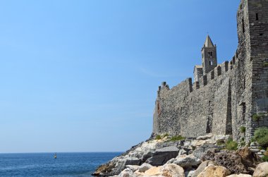 Landscape with sea and ancient buildings clipart