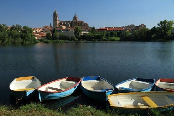 stock image Boats in sun and antique city