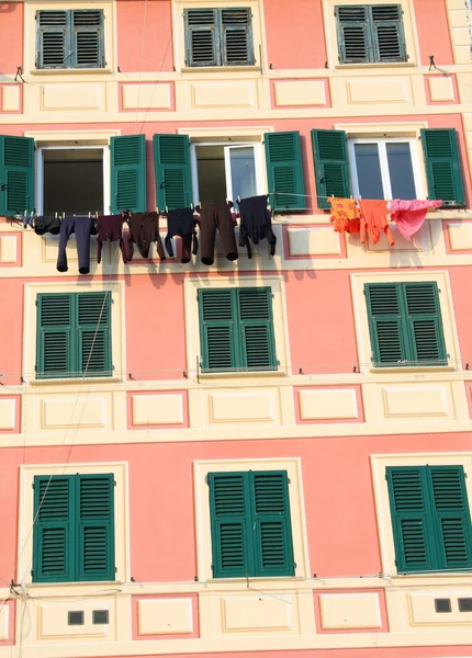 stock image Facade with windows and landry in Camogli
