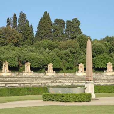 Egyptian obelisk in italian garden clipart