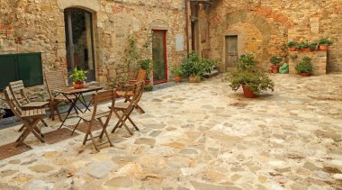 Paved rustic terrace in Tuscany clipart