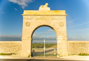 Marble gate - arc to Chateau Leoville-Lascases vineyard in Medoc, France clipart
