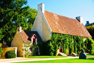 Two old small rural houses looking like place of living of seven dwarfs in clipart