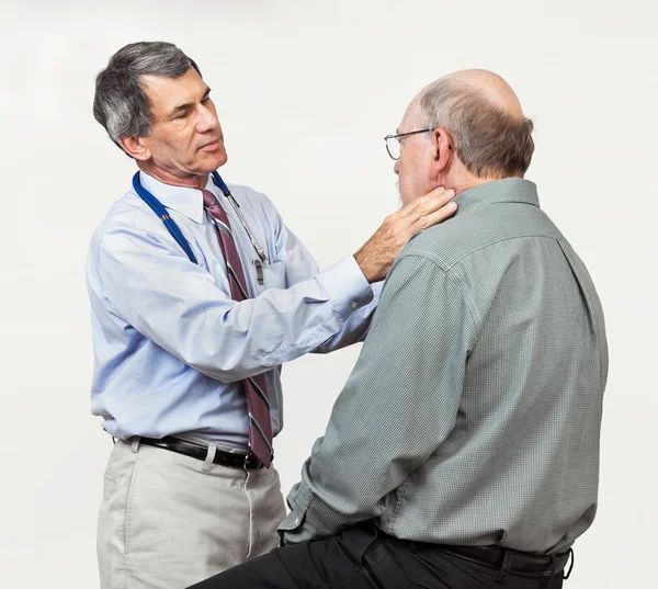 Doctor Examining Senior Patient's Swollen Glands — Stock Photo, Image