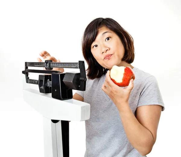 stock image Woman on Weight Scale Puzzled About Diet Plans