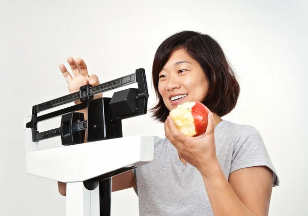 stock image Woman on Weight Scale Pleased with Her Weight Loss