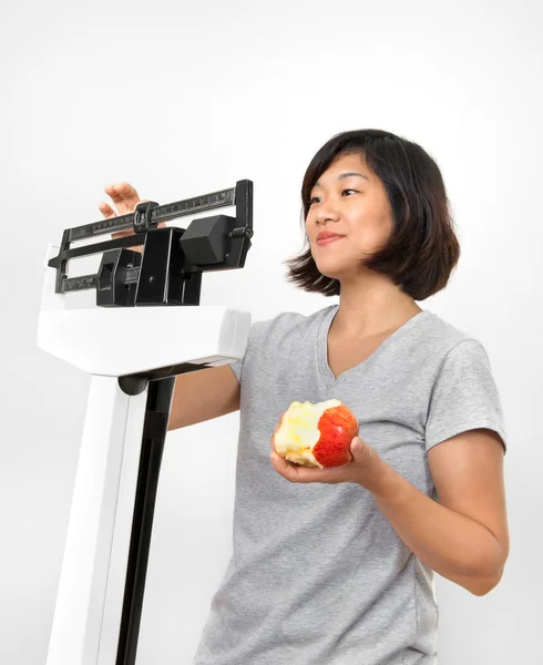 stock image Woman with Apple Weighing on Scale