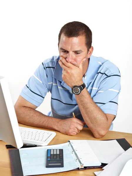 Worried young businessman at desk — Stock Photo, Image
