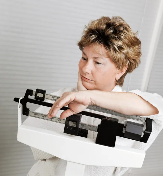 Mature Woman on Weight Scale — Stock Photo, Image