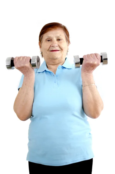Starsza kobieta robi treningu — Zdjęcie stockowe