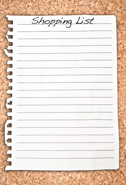 Vertical shopping list on cork background — Stock Photo, Image
