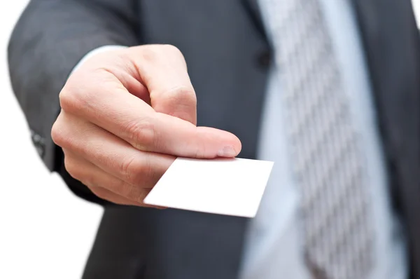空のビジネス カードを与える暗いスーツを着た男 ストック写真