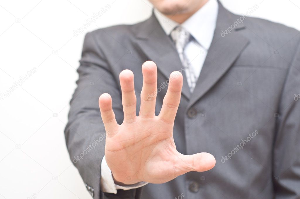Businessman expressing refusal with open hand