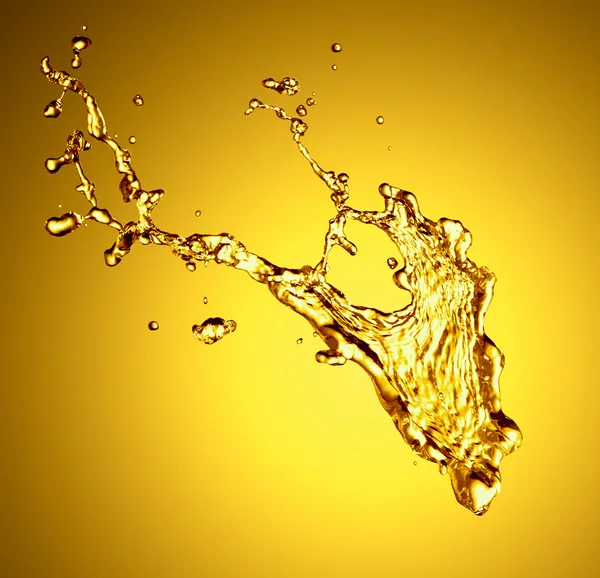 Salpicadura de líquido dorado —  Fotos de Stock