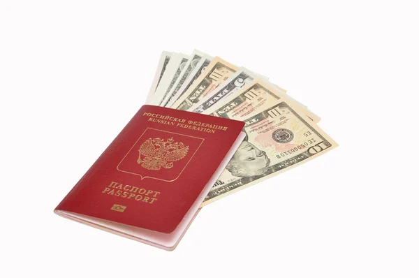 Долари в закордонному паспорті — стокове фото