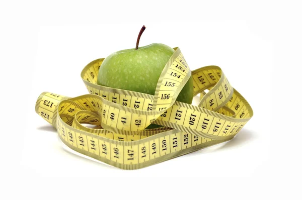 Medida de manzana y cinta verde — Foto de Stock