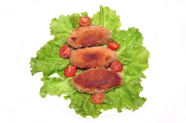 Cutlets on salad leaves — Stock Photo, Image