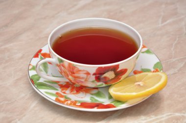 Cup with tea and lemon clipart