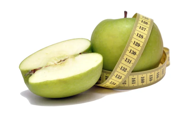 Yeşil elma ve şerit metre — Stok fotoğraf