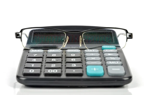 Calcolatrice e bicchieri — Foto Stock