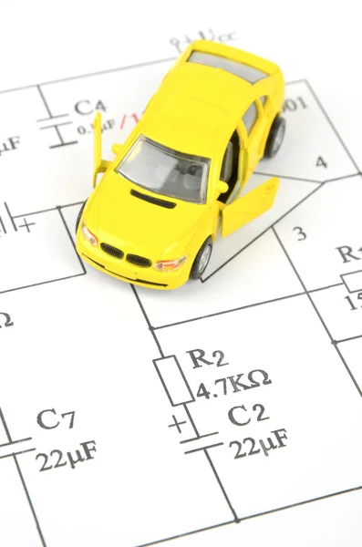 Schaltplan und Spielzeugauto — Stockfoto