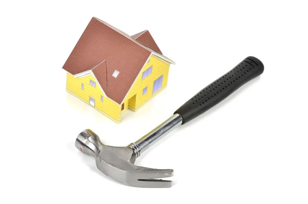 Hammer and model house — Stock Photo, Image