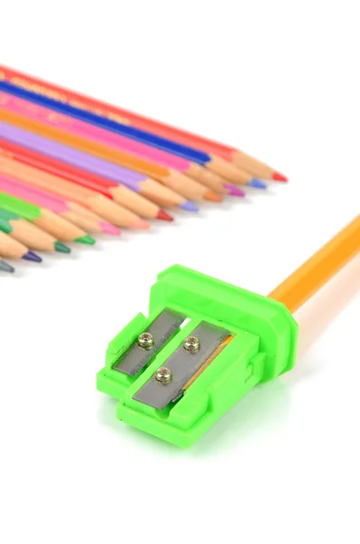 Color pencils and sharpener Royalty Free Stock Photos