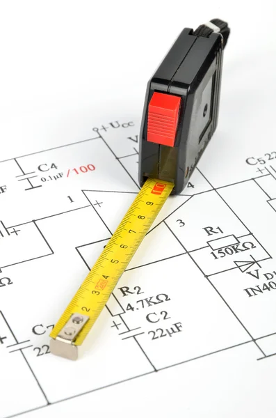 Circuit diagram and tape measure — Stock Photo, Image