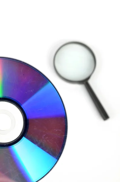 DVD and magnifier — Stock Photo, Image
