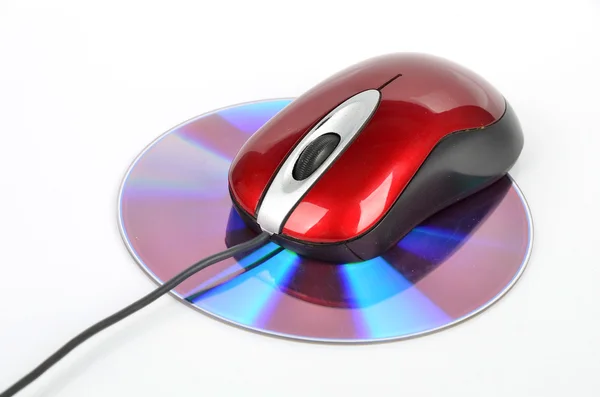 DVD et souris d'ordinateur rouge — Photo