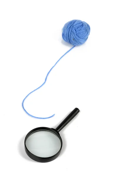 Magnifier and wool ball — Stock Photo, Image